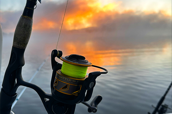 Photo of a fishing reel on a lake fishing expedition.